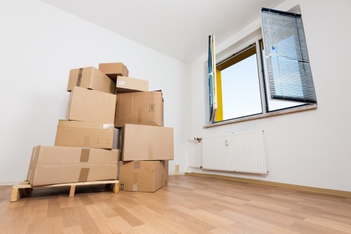 Stacked storage bins and furniture in a clean Foresthill storage area